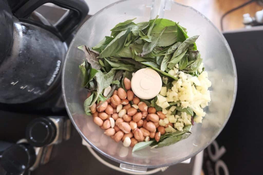Basil, peanuts and garlic before blending